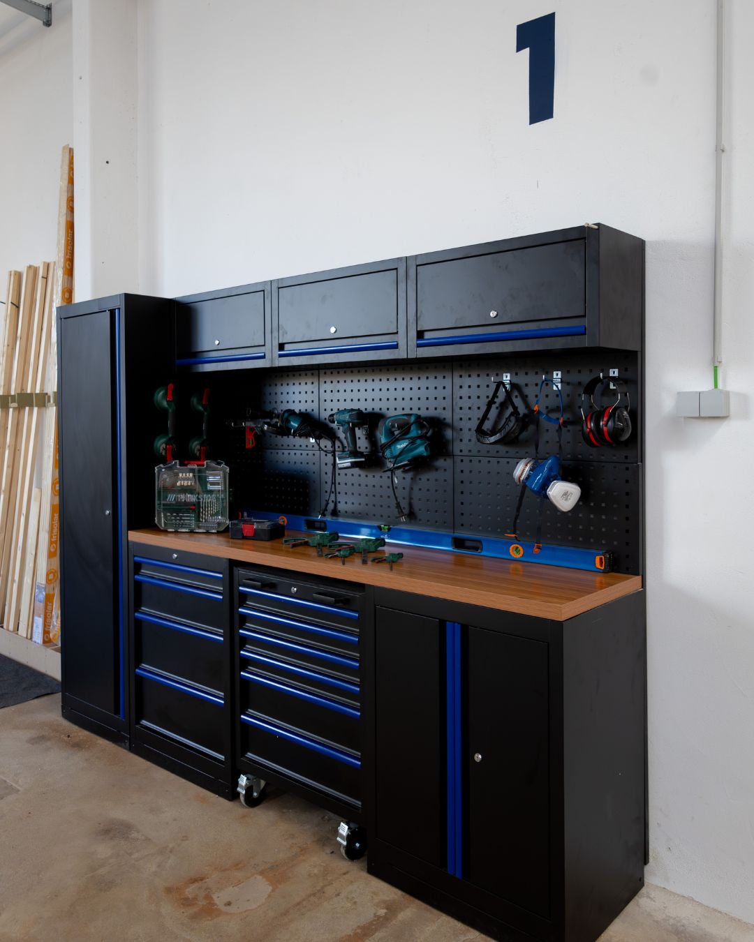 Spacious van conversion workshop in Porto with workbenches, power tools, and storage shelves