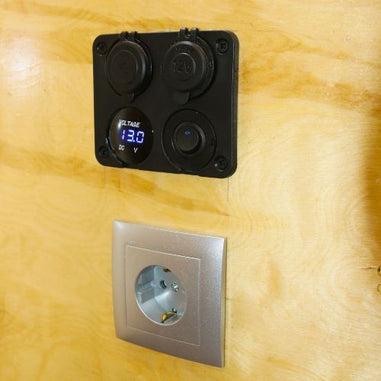 Electrical panel with digital voltage display on a campervan